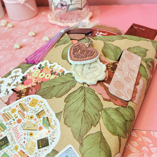 Unwrap a cozy surprise with Maliboo’s Blind Date With a Book! A beautifully wrapped mystery book paired with dreamy bookish accessories. Choose your genre — we’ll handle the magic. Perfect for book lovers, gifts, and self-care nights in.