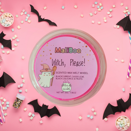 MaliBoo scented wax melt wheel on a pink background with Halloween decorations